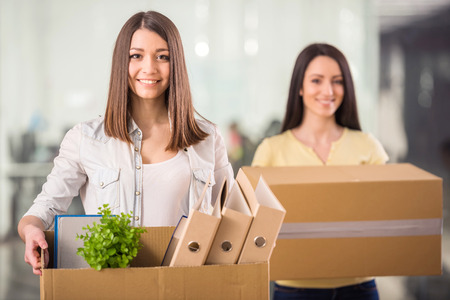 Two Women Moving Office